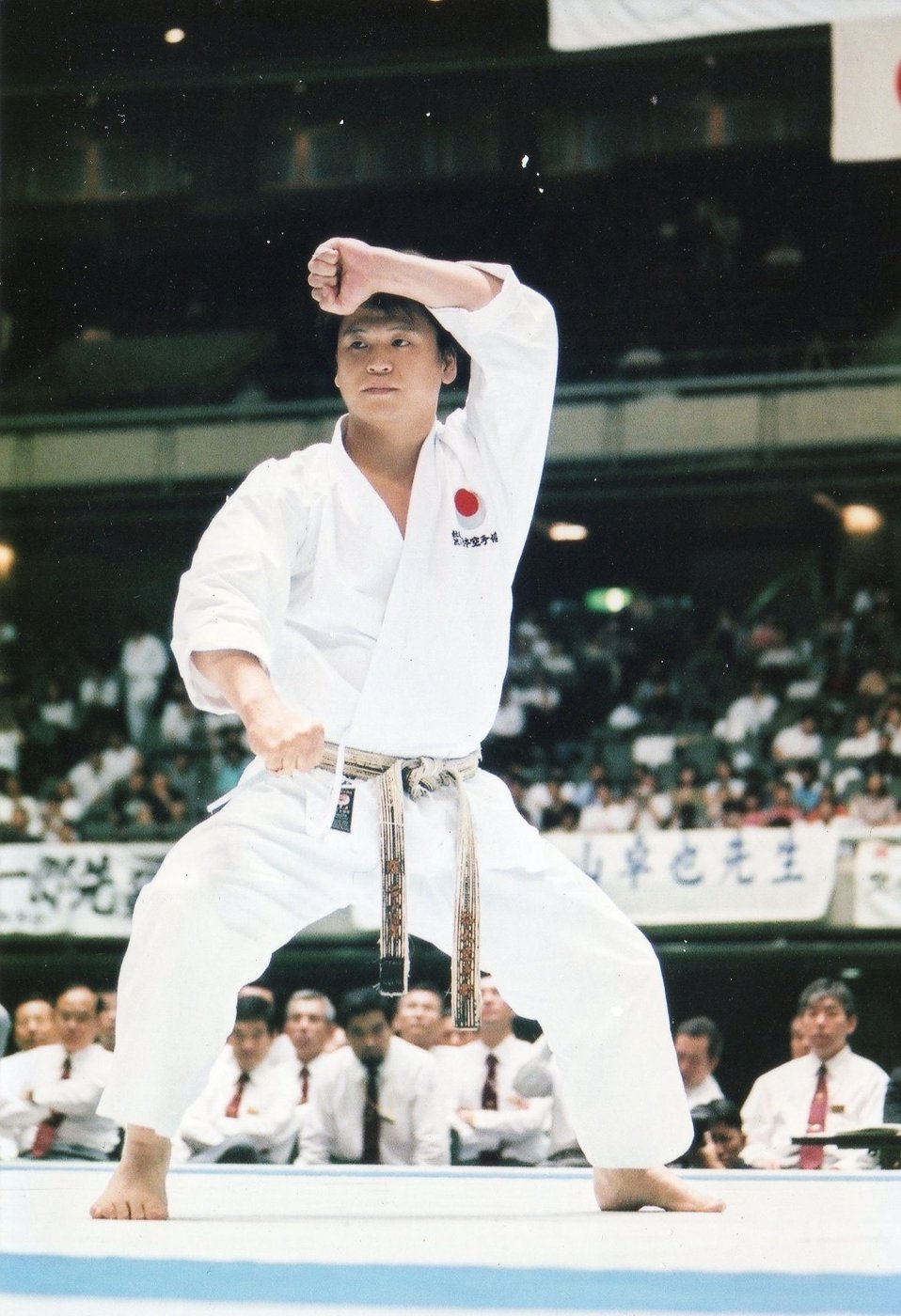 A karate-ka performing kata at a JKA championship